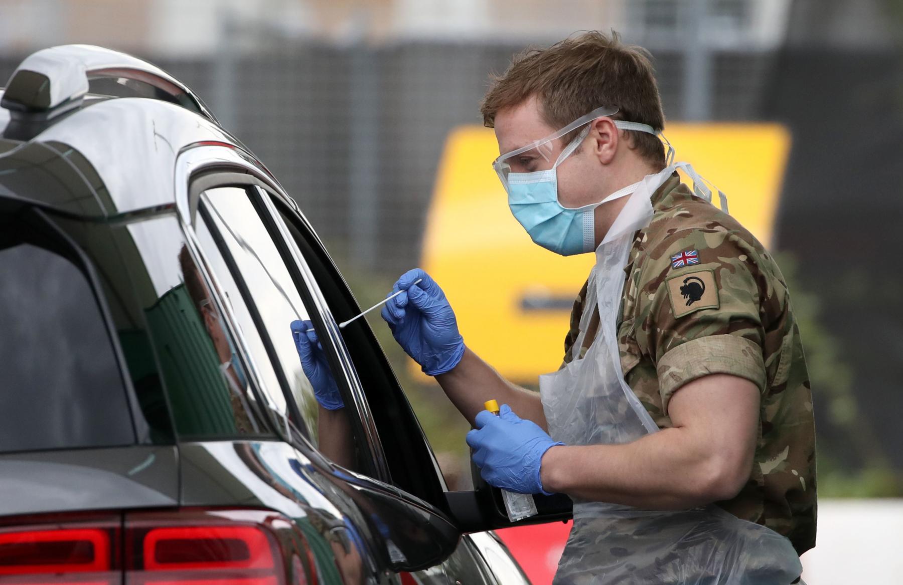TESTING TIME: A member of the armed services carries out a swab to detect Covid-19.